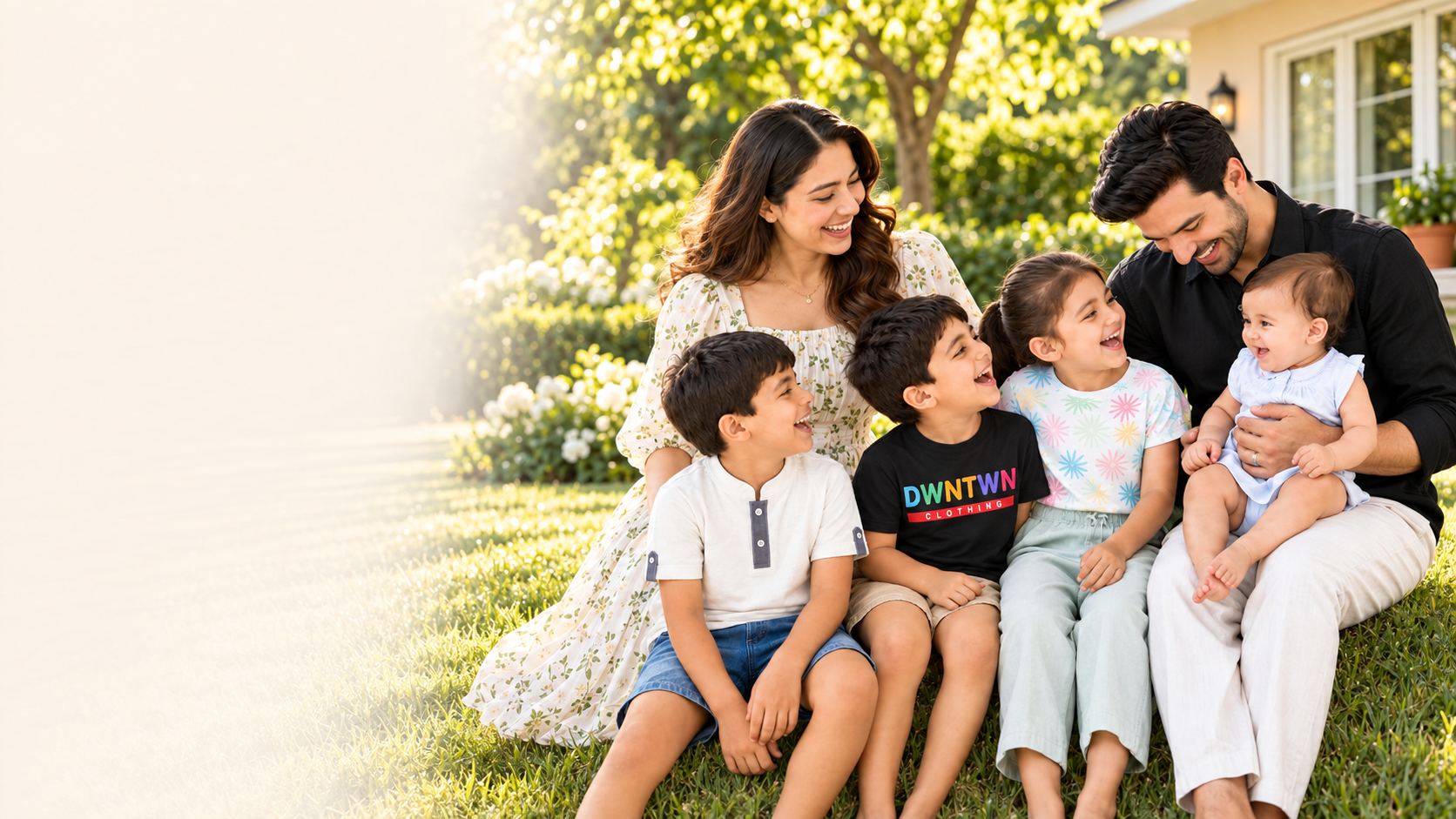 Happy DOWNTOWN Clothing family wearing children’s clothes outdoors